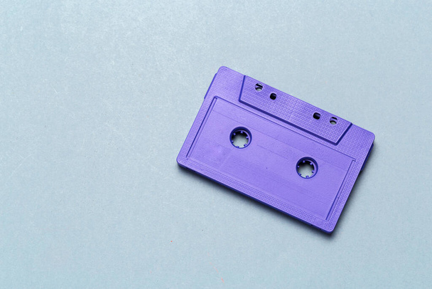 One single retro audio cassette on light grey background, top view - Foto, afbeelding