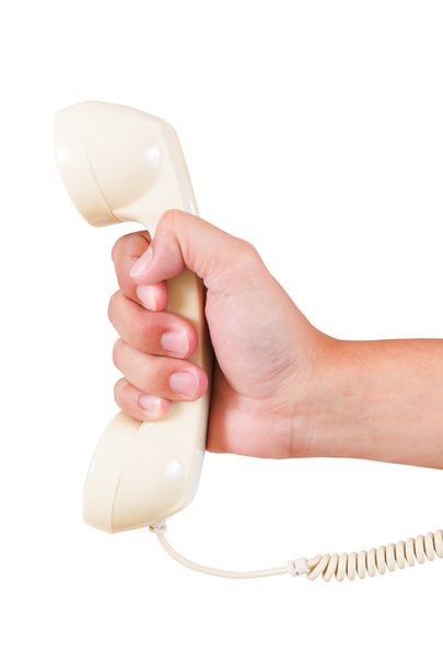Retro roterende vintage telefoon en hand op witte achtergrond - Foto, afbeelding