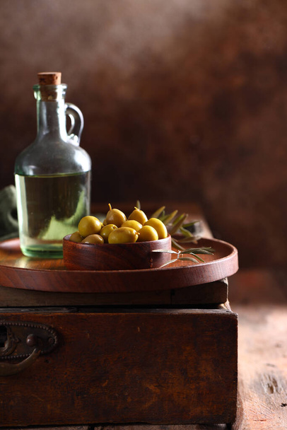 green organic olives in wooden bowls - Fotoğraf, Görsel