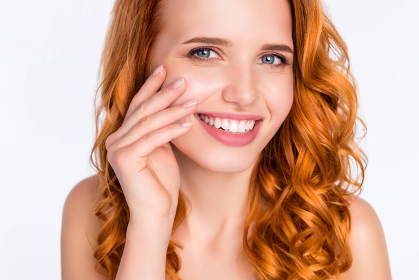 Close-up photo portrait of young model with wavy red hair smiling touching face soft smooth skin isolated on white color background - Фото, зображення