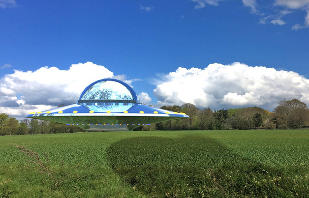 UFO flying over green field - Photo, Image