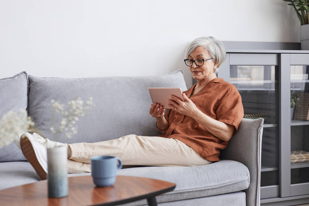 Modern Senior Woman Relaxing at Home - Foto, Imagem