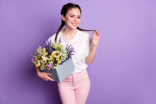 Photo of young attractive girl happy positive smile hold wildflowers bouquet isolated over violet color background - Foto, Bild