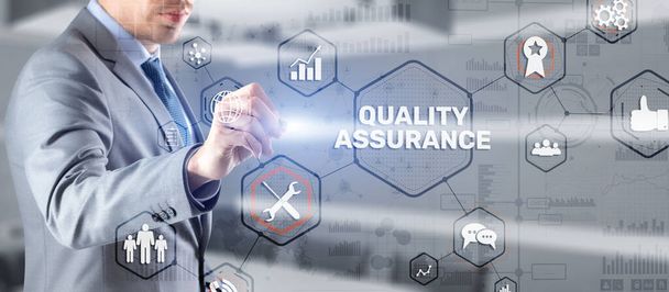 QA Businessman pressing Quality assurance button on virtual screens - Fotoğraf, Görsel