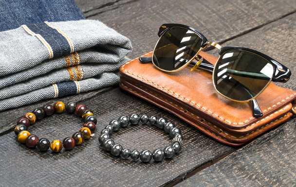 Men accessories, leather and denim fashion set on wood floor, vintage fashion collection - Photo, Image