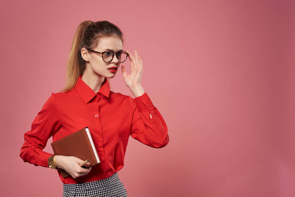 Business woman in red shirt and glasses with documents in hands working office - Φωτογραφία, εικόνα