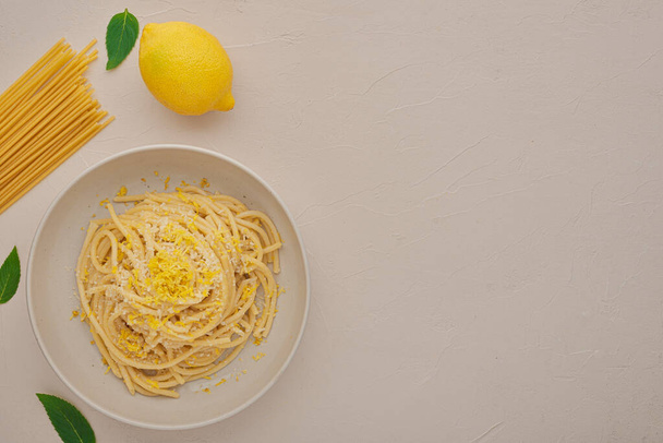 Top view plate LEMON PASTA and ingredients with copy space - Foto, afbeelding