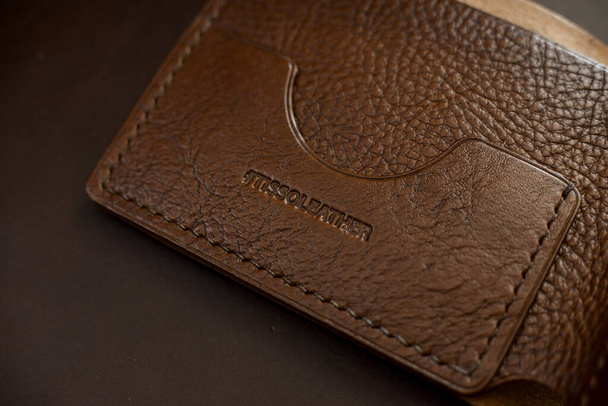brown leather card holder  on a dark background - Foto, immagini