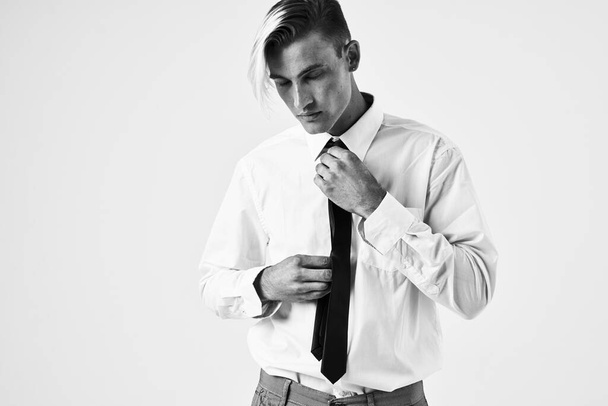 confident man with trendy hairstyle in white shirt - Photo, Image