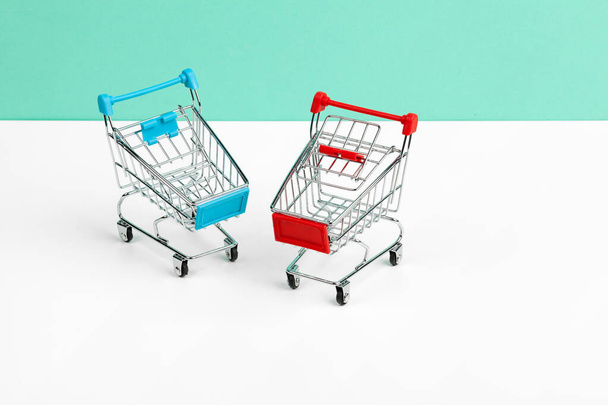 Mock up shoppong online cart on desk table office soft blue wall - Fotoğraf, Görsel