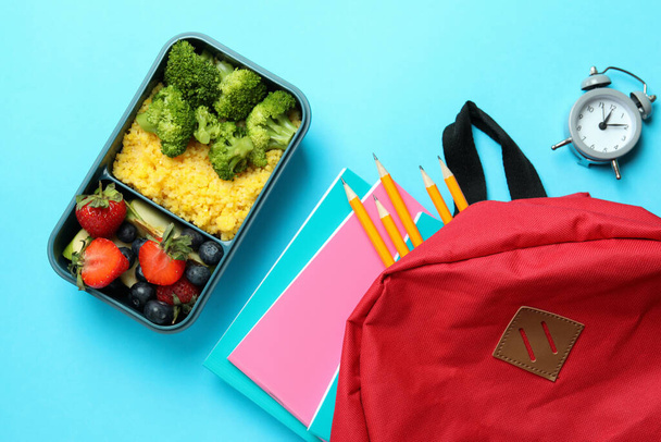 Study concept with lunch box on blue background - Photo, Image