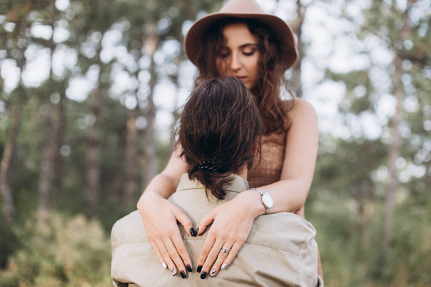 Boyfriend and Girlfriend hug each other in nature.  - Photo, image