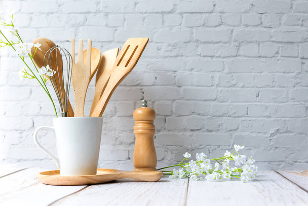 Kitchen tools and kitchenware utensil object with ingredients on kitchen shelf wood white for healthy eat and health care life.  Wall white brick background, copy space for text - 写真・画像