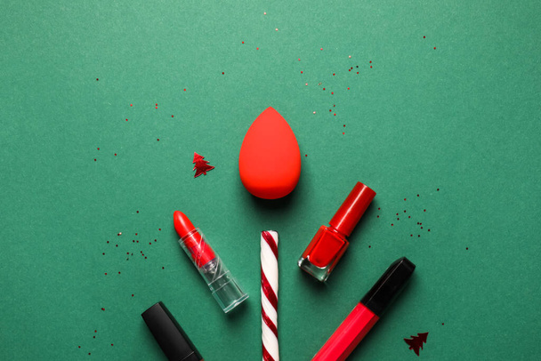 Christmas composition with makeup supplies on color background - Foto, immagini