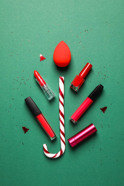 Christmas composition with makeup supplies on color background - Foto, Imagem