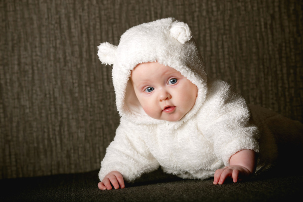 Little sweet baby in white bear costume - Fotoğraf, Görsel