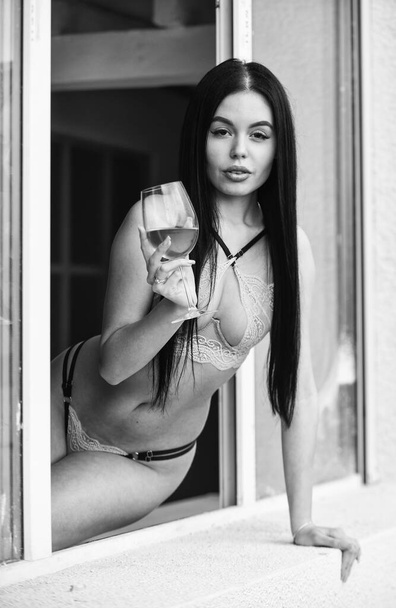 portrait with glass and champagne. Woman relaxing at home. Luxury life concept. Girl you dream about. bra and panties. Rich sexy chic. bondage. sexy brunette female in lingerie drink wine in glass - Foto, Imagen