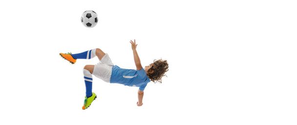 Flyer. Little boy, football soccer player in action, motion training isolated on white studio background. Concept of sport, game, hobby - Fotoğraf, Görsel