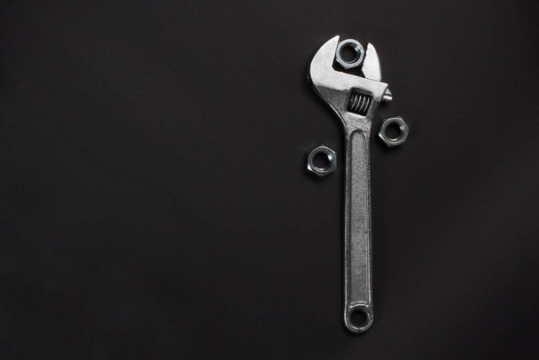 wrench and screw nuts dark background - Photo, Image