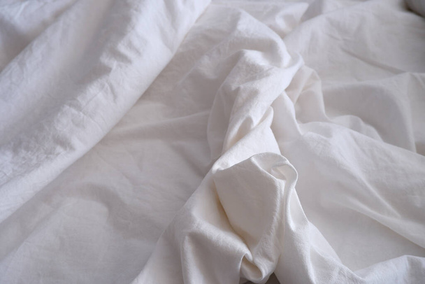 Bed linen texture. White bed linen background. Bed. Interior. - Фото, изображение