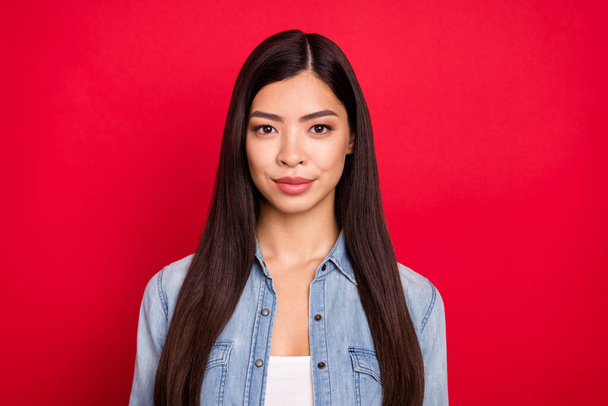 Photo of young attractive asian girl confident concentrated focused serious isolated over red color background - Photo, Image