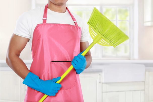 man's body with broom cleaning equipment - 写真・画像