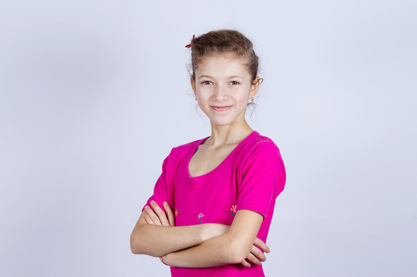 Happy young girl with arms crossed - Foto, imagen