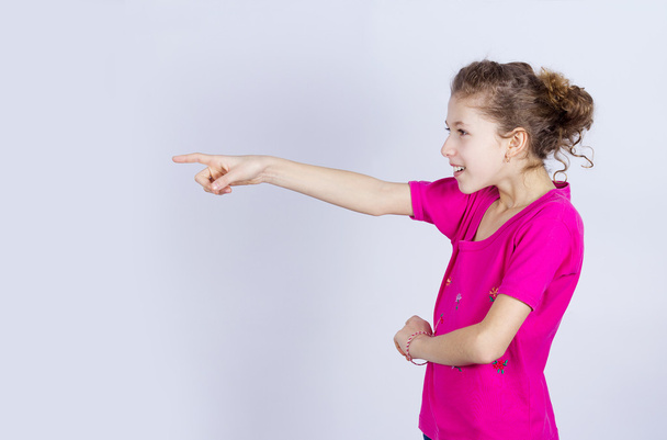 Girl pointing at someone - Photo, image
