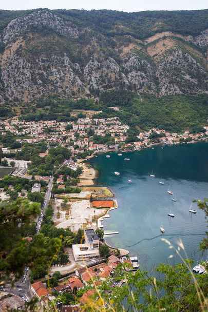 Unrealistically beautiful view of the Bay of Kotor on a beautiful summer day in Montenegro. Very beautiful view of the fjord from above - 写真・画像