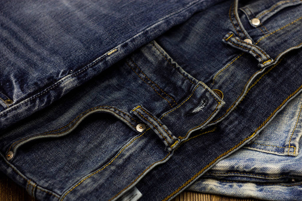 blue jeans are lying on the table - Foto, afbeelding