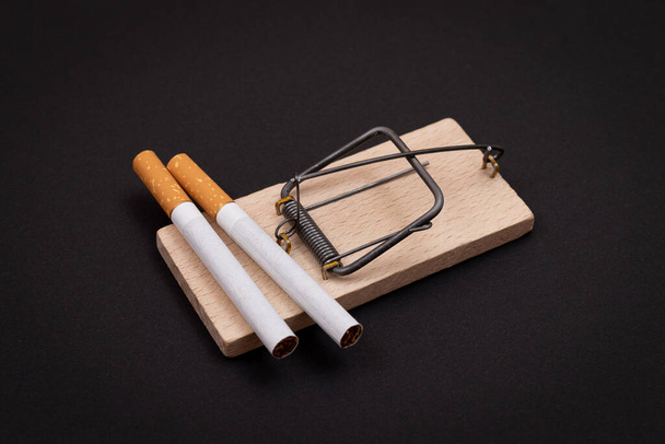 Tobacco Addiction - Cigarettes in Wooden Mousetrap - Foto, Imagem