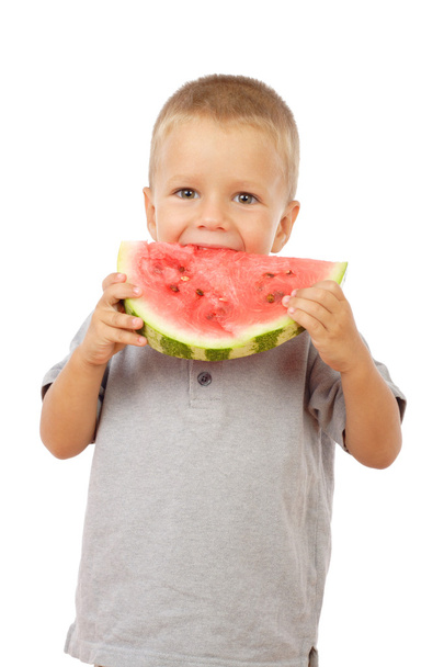 Little boy eating watermelon, studio shoot - Fotografie, Obrázek