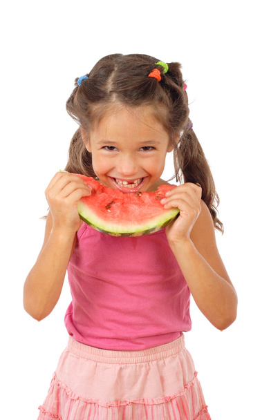 Smiling little girl eating watermelon, studio shoot - Photo, Image