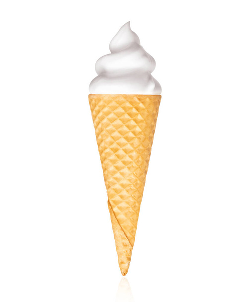 Vanilla soft serve ice cream in wafer cone close-up, isolated on white background - Foto, imagen