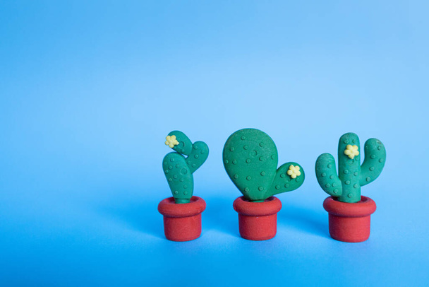 Cactus shaped erasers on a blue light background. Horizontal image. Copy-space - Foto, immagini