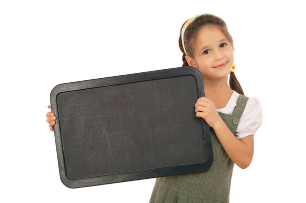 Little schoolgirl with empty chalkboard, horizontal, isolated on white - Fotoğraf, Görsel