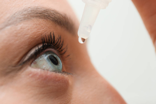Young woman using eye drops, closeup view - Foto, Imagem