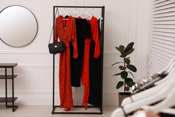 Collection of trendy women's garments in clothing rental salon - Foto, Imagem