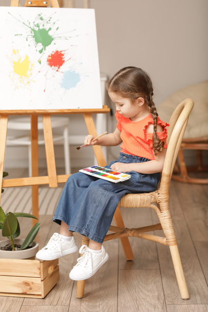 Cute little artist painting at home - Fotó, kép