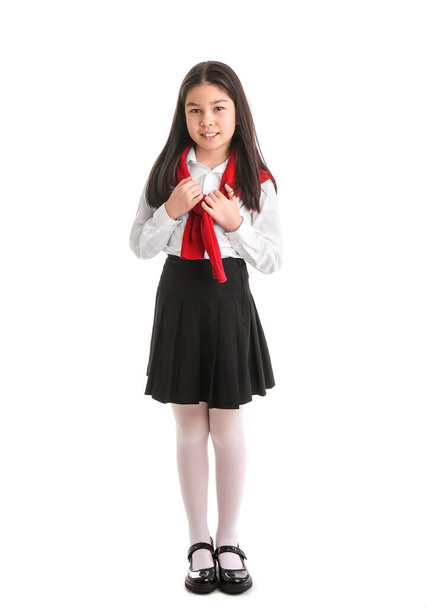 Cute Asian schoolgirl on white background - Фото, изображение