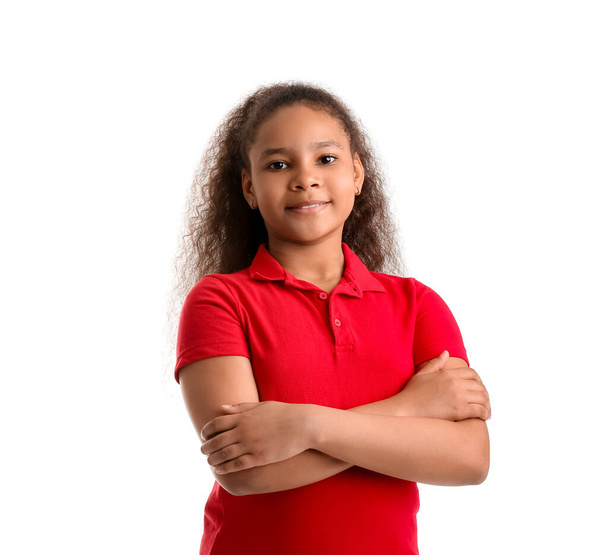 Cute African-American schoolgirl on white background - Foto, Imagem