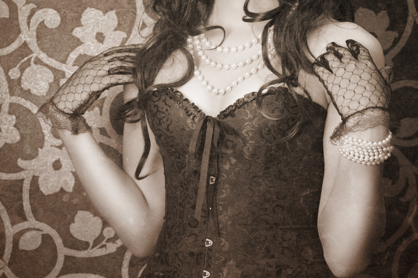 Woman wearing black corset and pearls - Fotografie, Obrázek
