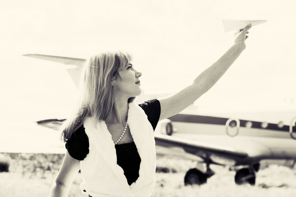 Woman holding paper plane - Fotografie, Obrázek