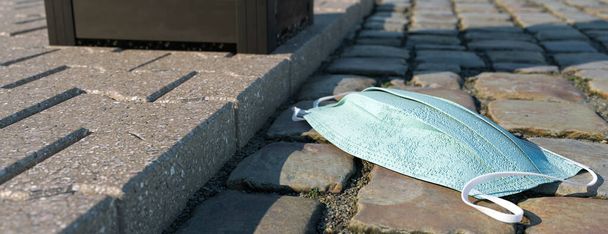 Covid surgical face coverings littering the street 3d render - Foto, imagen