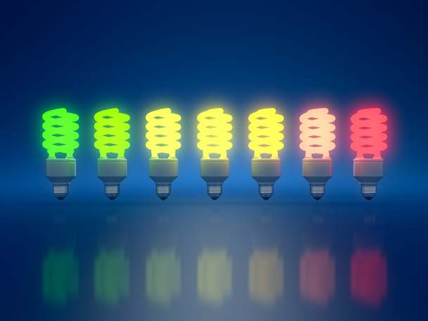 3D-Darstellung von Farb-Glühbirnen auf blauem Hintergrund - Foto, Bild