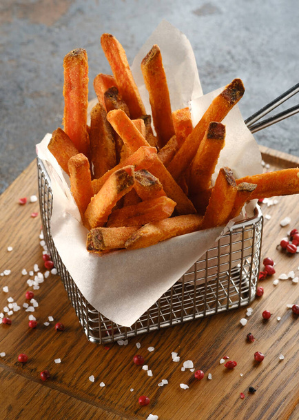 Sweet potato chips Fries on a wooden Board - Valokuva, kuva