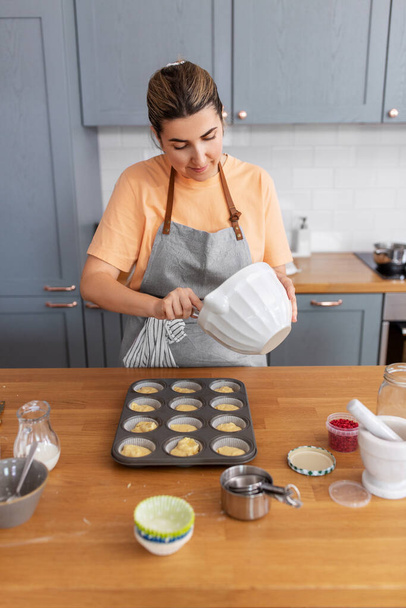 woman cooking food and baking on kitchen at home - Photo, Image