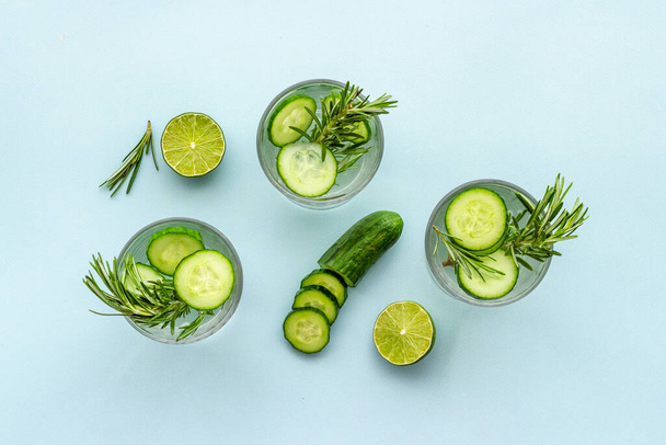 Homemade lemonade with cucumber lemon slices and herbs - Photo, image