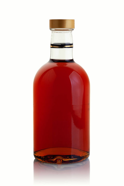 A bottle with a strong alcoholic drink on a white background - Photo, Image