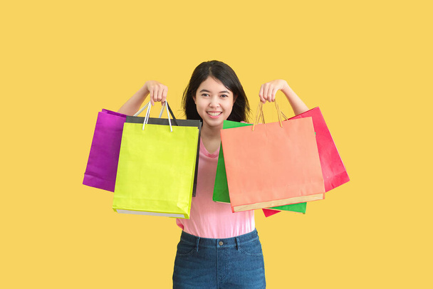 Asian woman in summer. She smiling and has happy shopping bags. Summer Surprise Sale concept. - Zdjęcie, obraz
